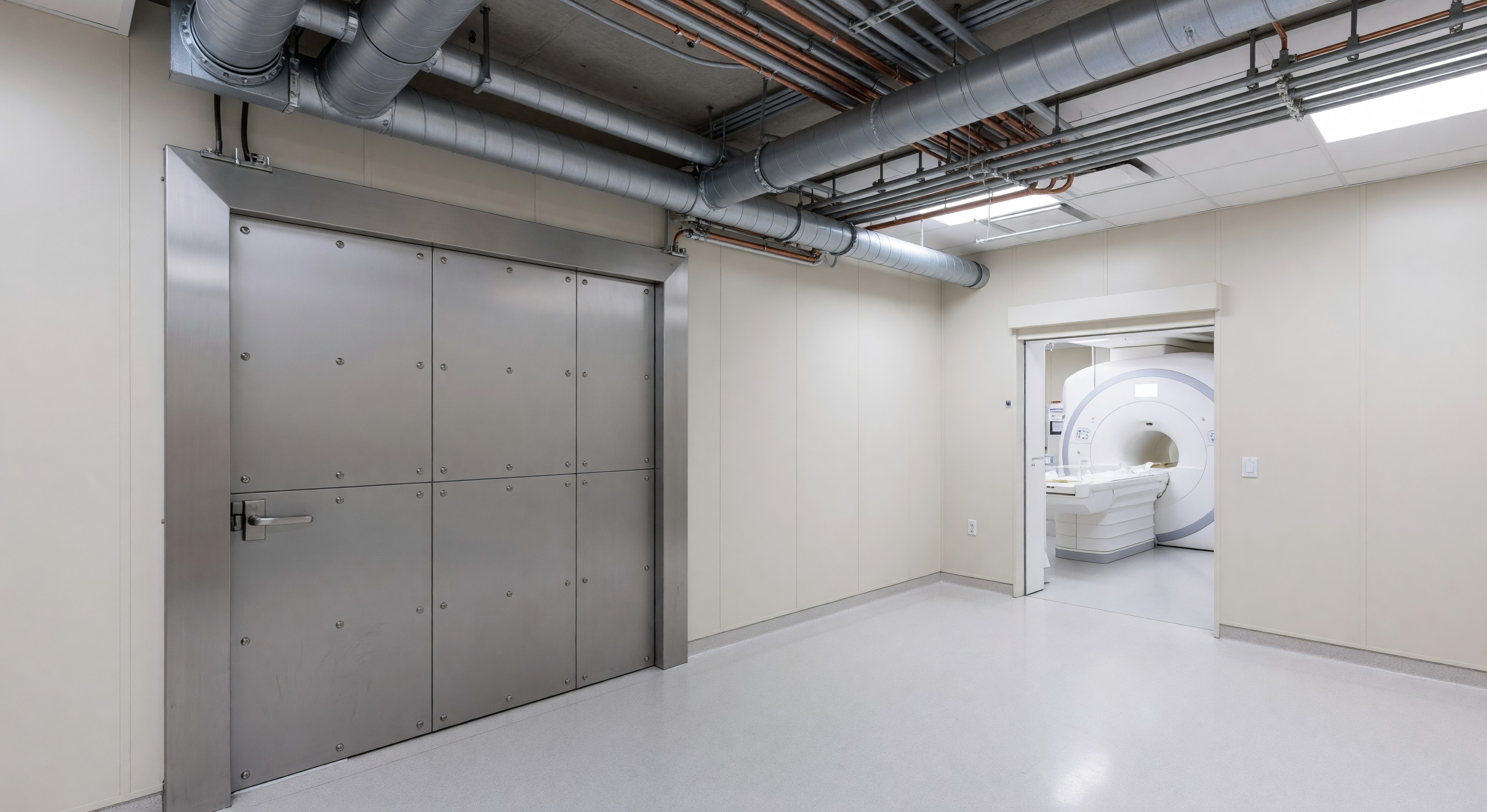 Hospital MRI suite with RF shielding door and HVAC infrastructure visible