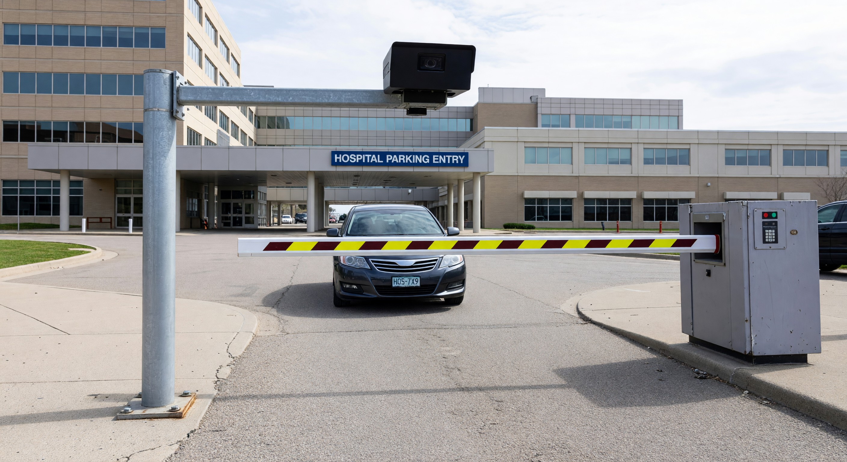 LPR camera mounted at hospital parking entry lane capturing vehicle plate for access control