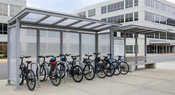 Hospital employee bicycle parking shelter and transit bus stop for staff transportation alternatives