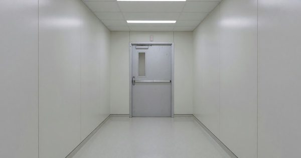 Hospital corridor with controlled exit door and wander management sensor